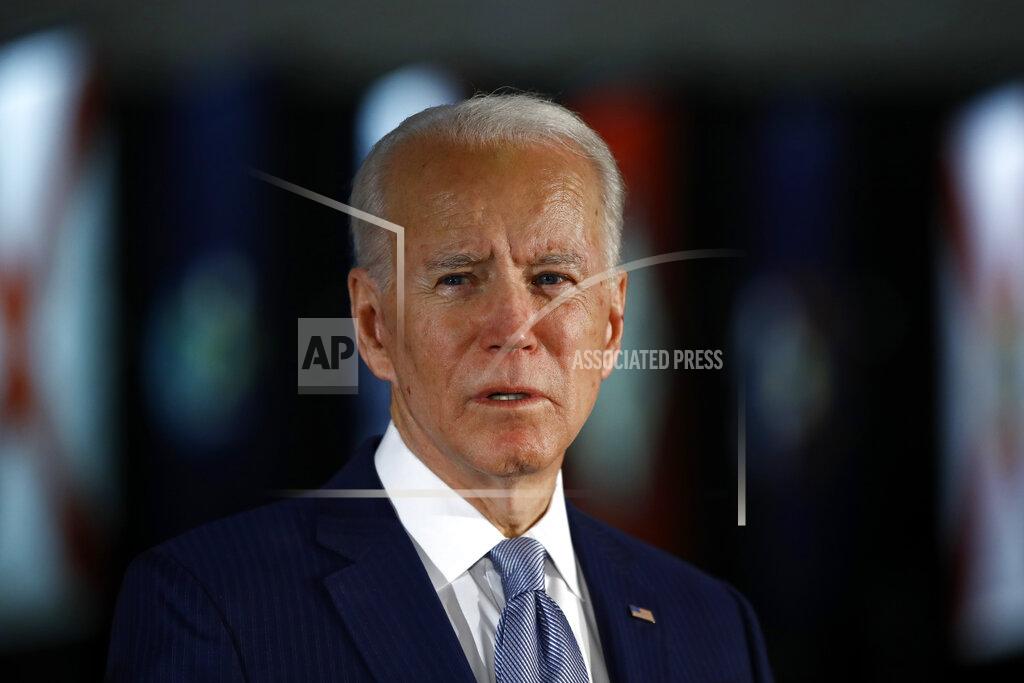 FILE - In this March 10, 2020, file photo, Democratic presidential candidate former Vice President Joe Biden speaks to members of the press at the National Constitution Center in Philadelphia. The police killing of George Floyd and the civil and political unrest that’s rocked the nation in the week since has the potential to reshape Joe Biden’s vice-presidential selection process. (AP Photo/Matt Rourke, File)