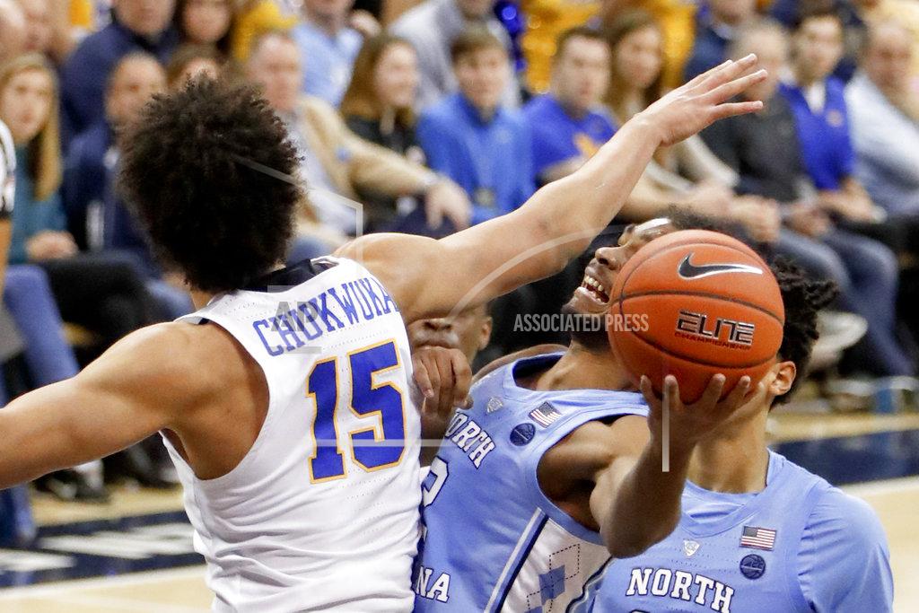 Keith Srakocic North Carolina's Coby White, right, tries to get a shot around Pittsburgh's Kene Chukwuka (15) during the second half of an NCAA college basketball game, Saturday, Jan. 5, 2019, in Pittsburgh. North Carolina won 85-60. (AP Photo/Keith Srakocic)