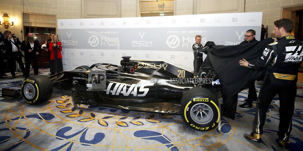 Steven Paston A general view of the new livery being unveiled by drivers Kevin Magnussen and Romain Grosjean during the Rich Energy Haas F1 Team 2019 car launch at the Royal Automobile Club, in London, Thursday, Feb. 7, 2019. (Steven Paston/PA via AP)