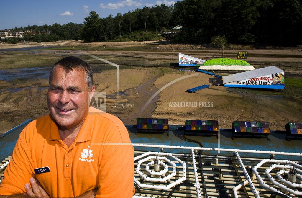 FILE - In this July 15, 2008 file photo, Tommy Bartlett Show owner Tom Diehl poses in Lake Delton, Wis. The coronavirus pandemic has forced an iconic Wisconsin Dells-area water ski show to shut down forever. Diehl, president and co-owner of the Tommy Bartlett Show in Lake Delton, said Wednesday, Sept. 16, 2020 that the show can't recover from the loss of revenue this summer. The show was preparing for its 70th season when the pandemic happened, forcing Diehl to cancel the season. (AP Photo/Morry Gash, File)