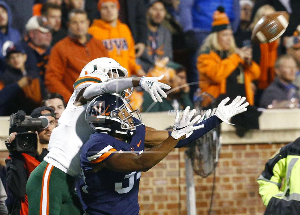 Steve Helber Virginia cornerback Bryce Hall (34) looks to intercept a pass intended for Miami wide receiver Mark Pope, left, during the second half of an NCAA college football game in Charlottesville, Va., Saturday, Oct. 13, 2018. Virginia defeated Miami 16-13. Hall dropped the ball. (AP Photo/Steve Helber)