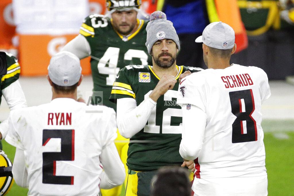 Mike Roemer Green Bay Packers quarterback Aaron Rodgers (12) greets Atlanta Falcons quarterbacks Matt Ryan (2) and Matt Schaub (8) following an NFL football game, Monday, Oct. 5, 2020, in Green Bay, Wis. (AP Photo/Mike Roemer)