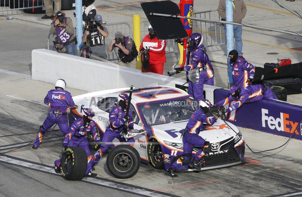 Terry Renna Denny Hamlin makes a pit stop during the NASCAR Cup Series road course auto race at Daytona International Speedway, Sunday, Feb. 21, 2021, in Daytona Beach, Fla. (AP Photo/Terry Renna)