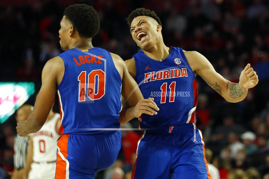 Joshua L. Jones Florida forward Keyontae Johnson (11) and guard Noah Locke (10) celebrate late in the second half of the team's NCAA college basketball game against Georgia on Wednesday, March 4, 2020, in Athens, Ga. (Joshua L. Jones/Athens Banner-Herald via AP)