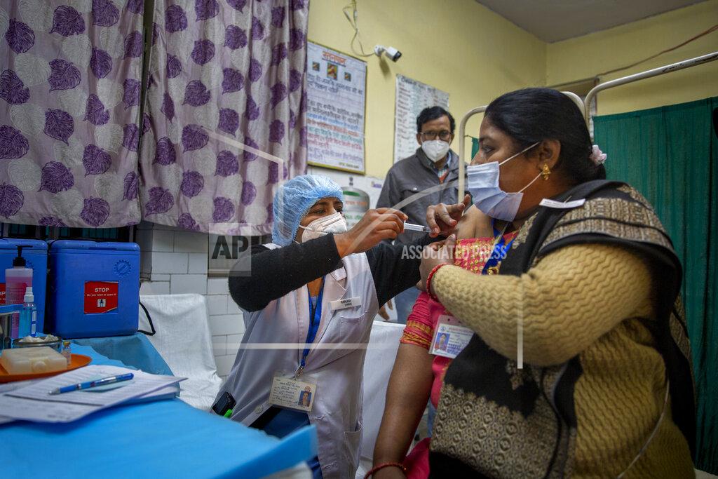 Altaf Qadri A health worker engages in a COVID-19 vaccine delivery system trial in New Delhi, India, Saturday, Jan. 2, 2021. India tested its COVID-19 vaccine delivery system with a nationwide trial on Saturday as it prepares to roll-out an inoculation program to stem the coronavirus pandemic. Saturday’s exercise included necessary data entry into an online platform for monitoring vaccine delivery, along with testing of cold storage and transportation arrangements for the vaccine, the health ministry had said.(AP Photo/Altaf Qadri)
