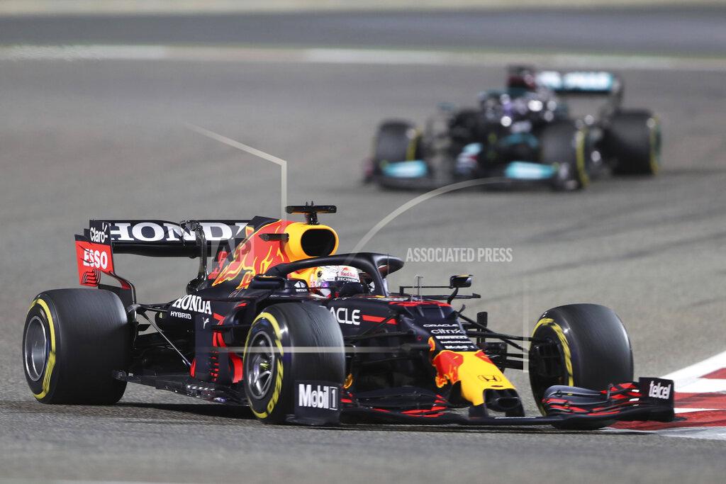 Kamran Jebreili Red Bull driver Max Verstappen of the Netherlands steers his car followed by Mercedes driver Lewis Hamilton of Britain during the Bahrain Formula One Grand Prix at the Bahrain International Circuit in Sakhir, Bahrain, Sunday, March 28, 2021. (AP Photo/Kamran Jebreili)