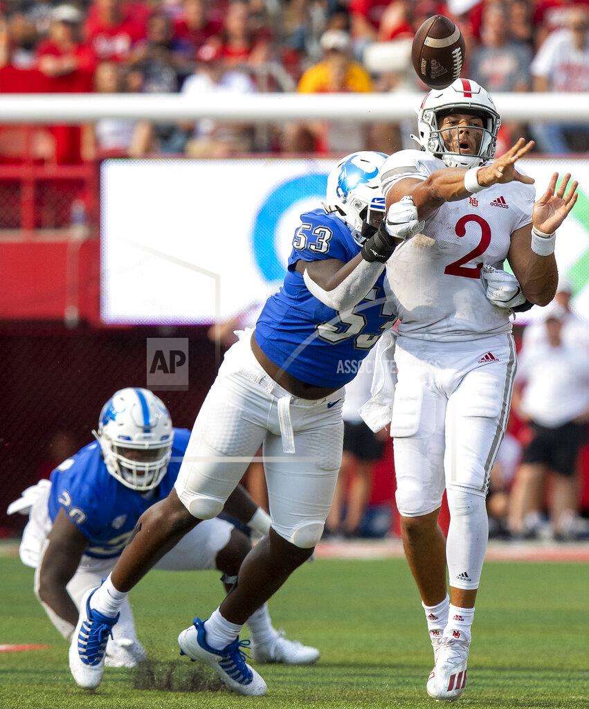 Francis Gardler Nebraska quarterback Adrian Martinez (2) gets hit by Buffalo's C. J. Bazile (53) as he throws in the third quarter of an NCAA college football game Saturday, Sept. 11, 2021, in Lincoln, Neb. (Francis Gardler/Lincoln Journal Star via AP)