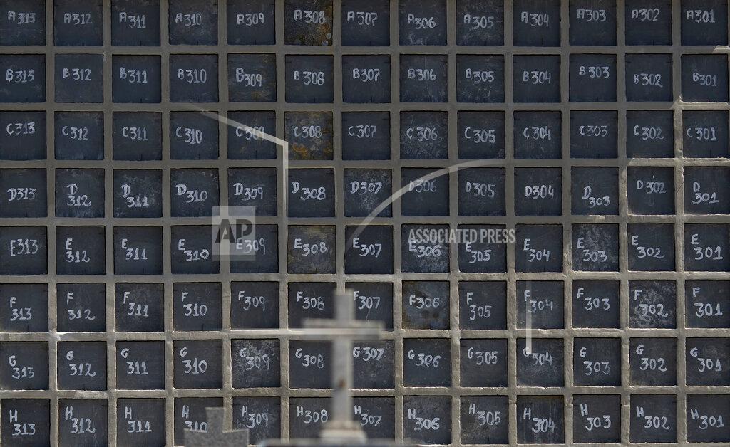 Silvia Izquierdo Numbers label new niches at the Iraja cemetery in Rio de Janeiro, Brazil, Thursday, April 30, 2020. There were already plans this year to create more tombs at Iraja cemetery, but the new coronavirus pandemic accelerated construction. (AP Photo/Silvia Izquierdo)