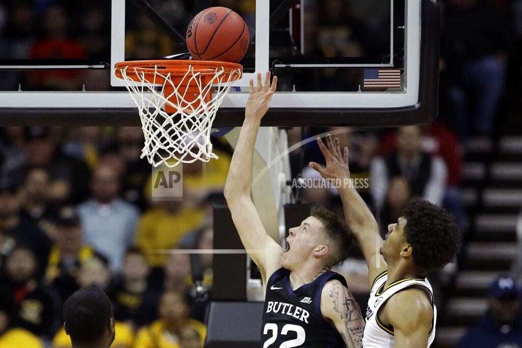 Charlie Riedel Butler forward Sean McDermott (22) gets past Missouri guard Mark Smith, right, to shoot during the first half of an NCAA college basketball game Monday, Nov. 25, 2019, in Kansas City, Mo. (AP Photo/Charlie Riedel)
