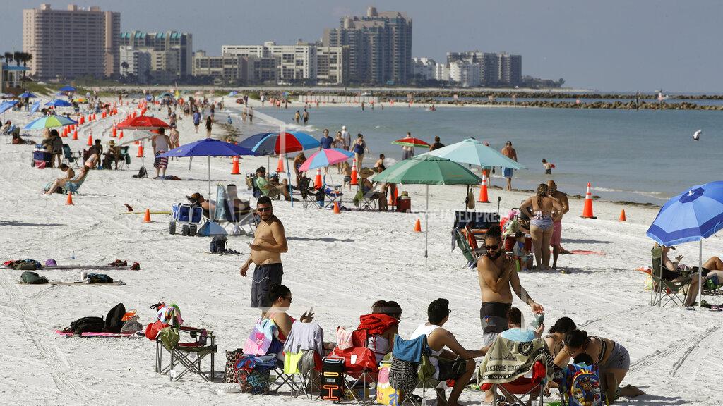 Chris O'meara Cones are set up to help beachgoers keep a safe distance from one another after Clearwater Beach officially reopened to the public Monday, May 4, 2020, in Clearwater Beach, Fla. Many public beaches and restaurants are reopening as part of Florida Gov. Ron DeSantis' plan to stop the spread of the coronavirus. (AP Photo/Chris O'Meara)