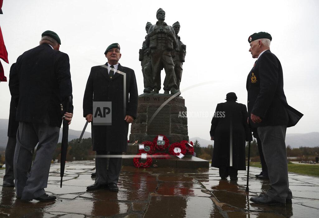 Andrew Milligan A small number of serving and former Royal Marine Commandos gather, at the Commando Memorial for the annual Remembrance Sunday ceremony, at Spean Bridge, near Fort William, Scotland, Sunday, Nov. 8, 2020. (Andrew Milligan/PA via AP)