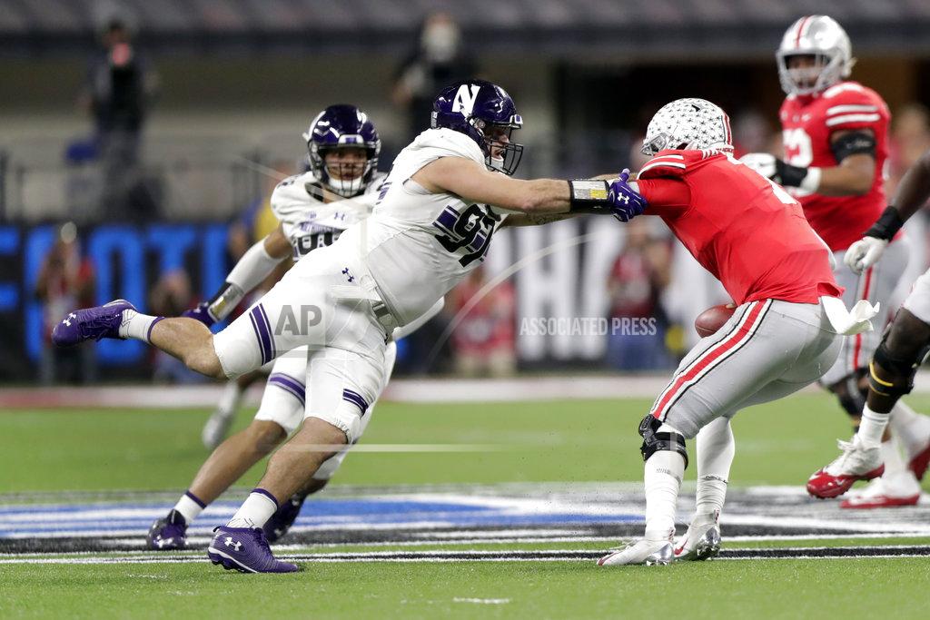 Michael Conroy Northwestern defensive lineman Joe Gaziano, left, tackles Ohio State quarterback Dwayne Haskins during the second half of the Big Ten championship NCAA college football game, Saturday, Dec. 1, 2018, in Indianapolis. (AP Photo/Michael Conroy)