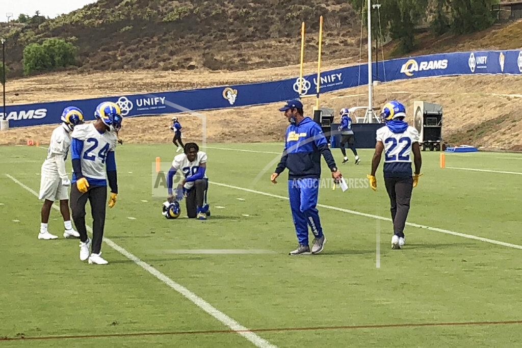 Greg Beacham Los Angeles Rams defensive coordinator Brandon Staley, second from right, instructs safety Taylor Rapp (24), cornerback Jalen Ramsey (kneeling) and cornerback Troy Hill (22) during football practice at the team's training complex in Thousand Oaks, California, Friday, Sept. 11, 2020. Staley is in his first season as an NFL coordinator after a meteoric rise in his profession since 2016, when he was the defensive coordinator at Division III John Carroll University. (AP Photo/Greg Beacham)