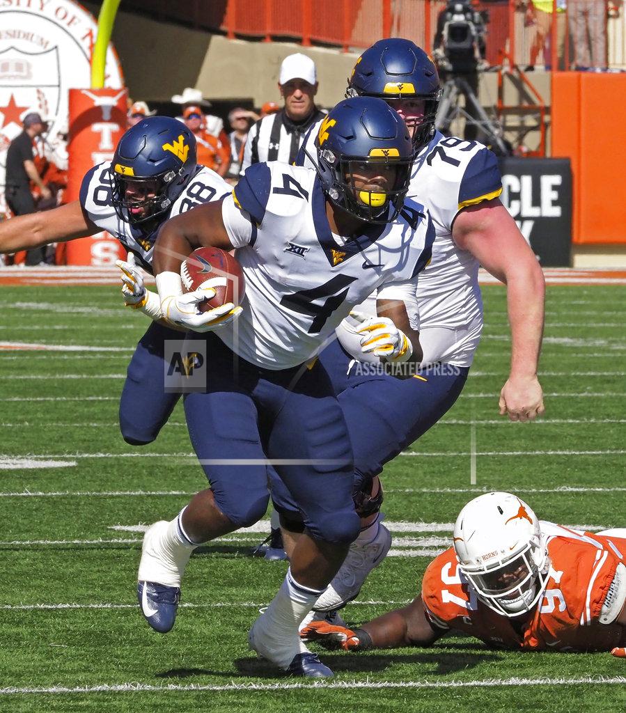 Michael Thomas West Virginia running back Laddie Brown (4) runs the ball during the first half of an NCAA college football game against Texas, Saturday, Nov. 3, 2018, in Austin, Texas. (AP Photo/Michael Thomas)