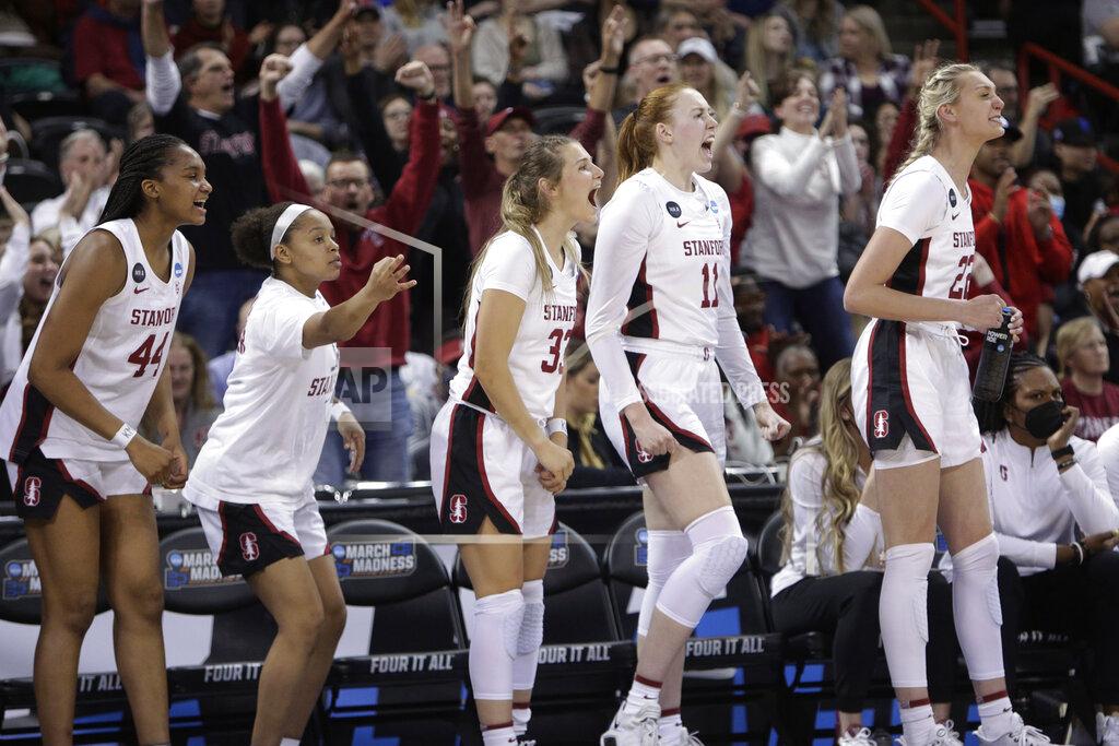 Young Kwak Stanford players cheer from the bench during the second half of a college basketball game against Maryland in the Sweet 16 round of the NCAA tournament, Friday, March 25, 2022, in Spokane, Wash. (AP Photo/Young Kwak)