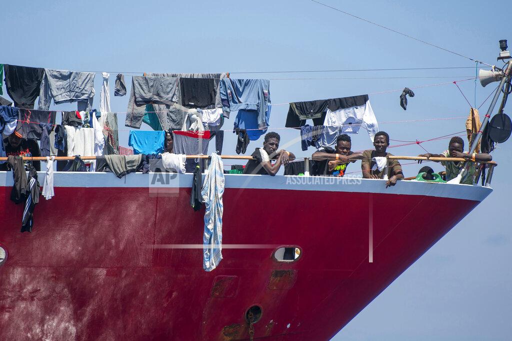 Rene' Rossignaud In this photo taken Tuesday, June 2, 2020, migrants dry their clothes aboard a tourist boats some 20 kilometers from Malta, . More than 400 migrants are living aboard pleasure cruise vessels, bobbing in the sea off Malta, many of them for weeks now. Rescued from human traffickers’ unseaworthy boats in several operations in the central Mediterranean since late April, the migrants, along with the Maltese government, are waiting for European Union countries to offer to take them. (AP Photo/Rene' Rossignaud)