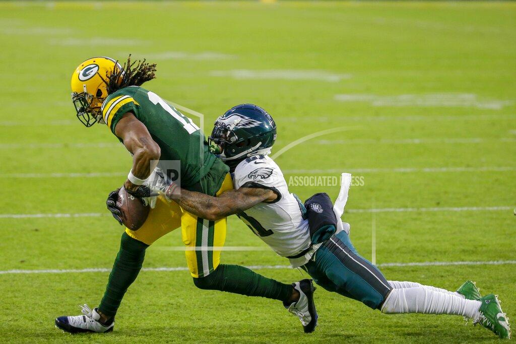 Mike Roemer Green Bay Packers' Davante Adams catches a pass with Philadelphia Eagles' Jalen Mills defending during the first half of an NFL football game Sunday, Dec. 6, 2020, in Green Bay, Wis. (AP Photo/Mike Roemer)