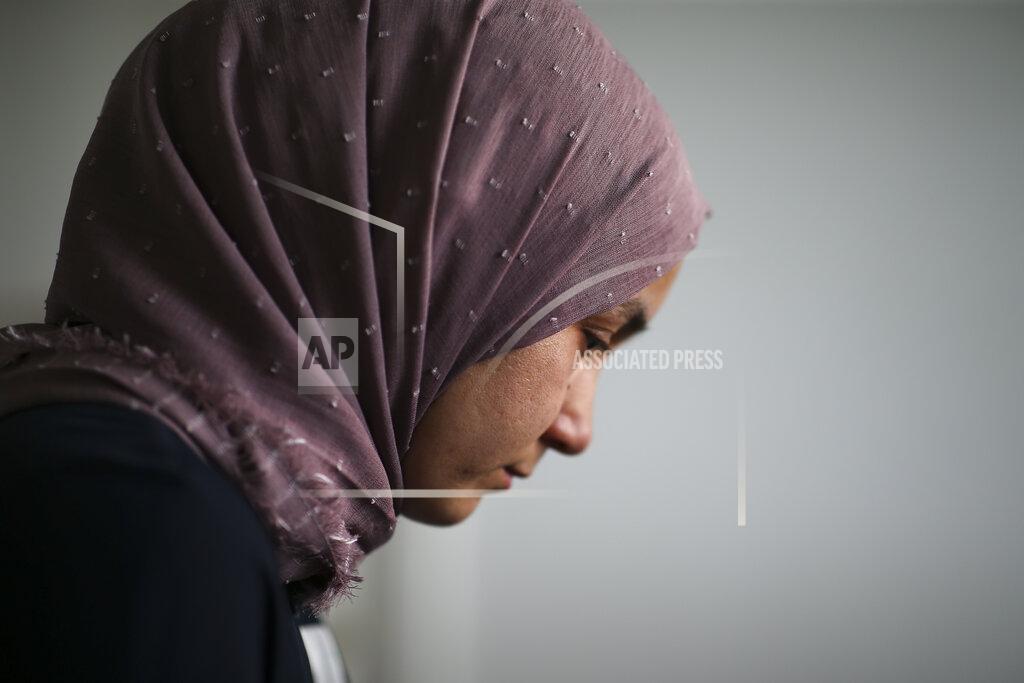 Emrah Gurel Uyghur Nursimangul Abdureshid, 34, reacts during an interview with The Associated Press in Istanbul, Turkey on May 4, 2022. Nearly one in 25 people in a county in the Uyghur heartland of China has been sentenced to prison on terrorism-related charges, in what is the highest known imprisonment rate in the world, an Associated Press review of leaked data shows. Abdureshid's brother, Memetali Abdureshid, who ran a car repair shop, was listed as being sentenced to 15 years and 11 months in prison on charges of "picking quarrels and provoking trouble” and “preparing to carry out terrorist activities." (AP Photo/Emrah Gurel)