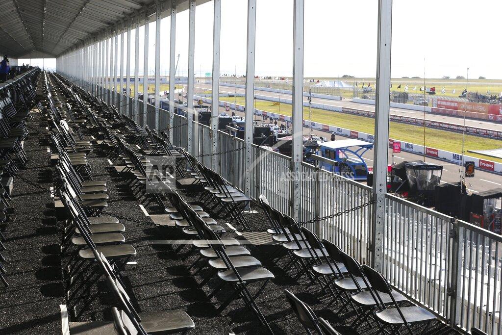 The spectator VIP area overlooking pit lane is virtually empty at the IndyCar Grand Prix of St. Petersburg, Friday, March 13, 2020 in St. Petersburg. NASCAR and IndyCar have postponed their weekend schedules at Atlanta Motor Speedway and St. Petersburg, due to concerns over the COVID-19 pandemic. (Dirk Shadd/Tampa Bay Times via AP)