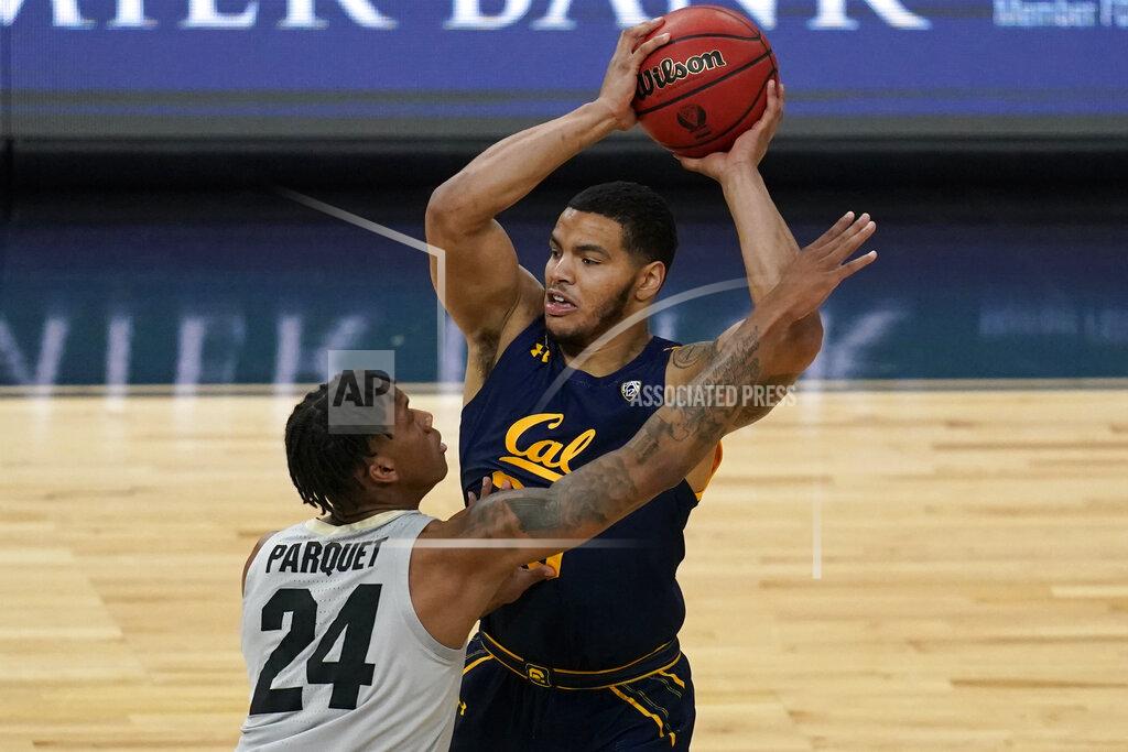 John Locher California's Matt Bradley (20) looks to pass around Colorado's Eli Parquet (24) during the first half of an NCAA college basketball game in the quarterfinal round of the Pac-12 men's tournament Thursday, March 11, 2021, in Las Vegas. (AP Photo/John Locher)