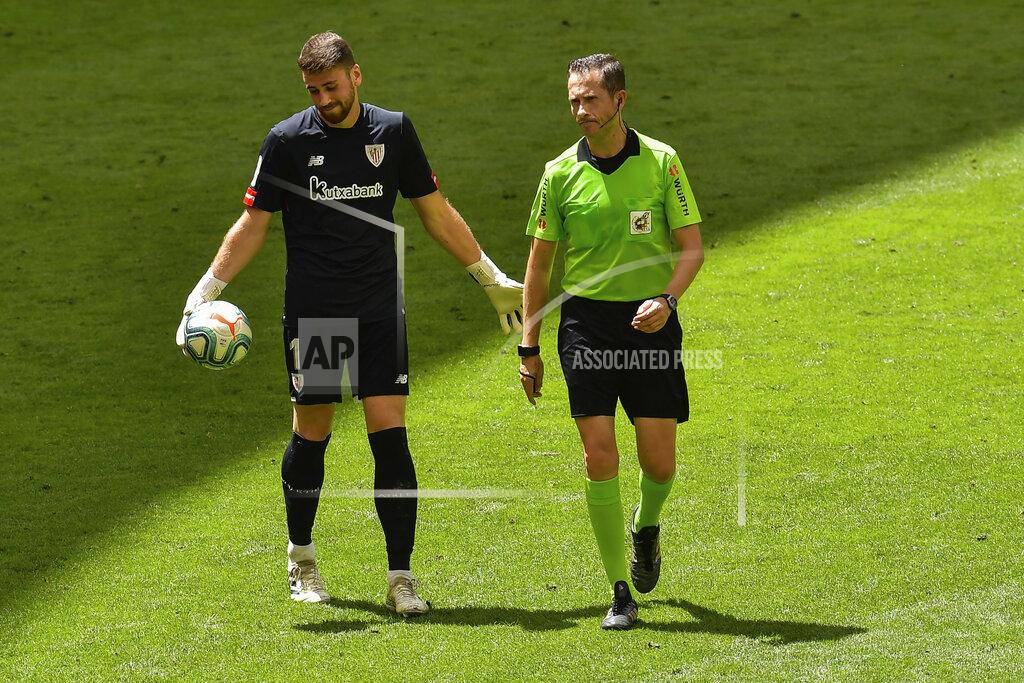 Athletic Bilbao's goalkeeper Unai Simon, left, reacts during the Spanish La Liga soccer match between Athletic Club and Real Madrid at the San Manes stadium in Bilbao, Spain, Sunday, July 5, 2020. (AP Photo/Alvaro Barrientos)