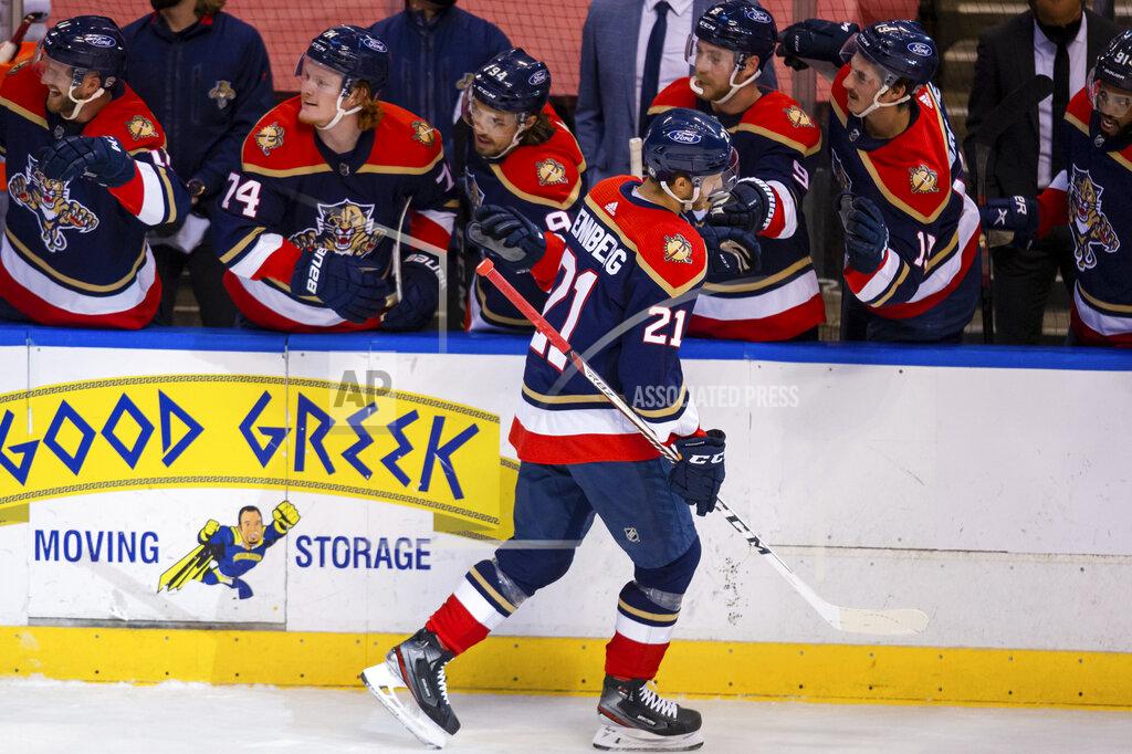 Mary Holt Florida Panthers center Alex Wennberg (21) celebrates with teammates after scoring a goal against the Tampa Bay Lightning during the first period of an NHL hockey game on Saturday, May 8, 2021, in Sunrise, Fla. (AP Photo/Mary Holt)