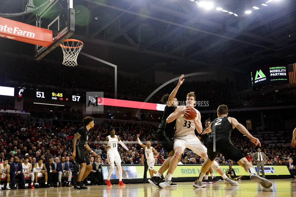 Albert Cesare Cincinnati center Chris Vogt (33) drives against Central Florida during the second half of an NCAA college basketball game Wednesday, Feb. 19, 2020, in Cincinnati. (Albert Cesare/The Cincinnati Enquirer via AP)