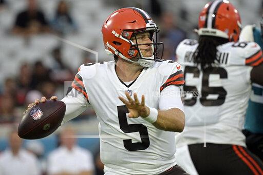 FILE - Cleveland Browns quarterback Case Keenum (5) looks for a receiver during the first half of an NFL preseason football game against the Jacksonville Jaguars in Jacksonville, Fla., in this Saturday, Aug. 14, 2021, file photo. Browns quarterback Baker Mayfield will sit out Thursday's game against the Denver Broncos with a painful left shoulder injury and backup Case Keenum will start. Cleveland announced the quarterback switch on Wednesday, Oct. 20, 2021, ending speculation about whether Mayfield would try to push through an injury to his non-throwing shoulder that he suffered last month and has worsened in recent weeks. (AP Photo/Phelan M. Ebenhack, File)
