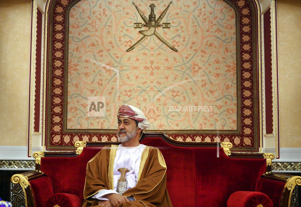 FILE - In this Feb. 21, 2020 file photo, Oman's ruler Sultan Haitham bin Tariq prepares for a meeting at al-Alam palace in the capital Muscat, Oman. The sultan announced Monday, Jan. 11, 2021, a shake-up of the country’s constitution with changes that include the appointment of a crown prince for the first time and steps to boost government transparency. The move, one year after the death of Sultan Qaboos bin Said comes as the government faces growing economic pressures at home. (Andrew Caballero-Reynolds/Pool via AP, File)