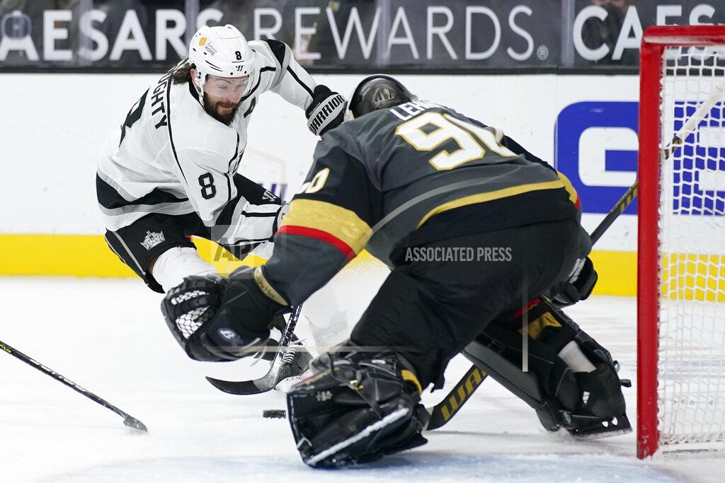 John Locher Los Angeles Kings defenseman Drew Doughty (8) attempts a shot on Vegas Golden Knights goaltender Robin Lehner (90) during the third period of an NHL hockey game Monday, March 29, 2021, in Las Vegas. (AP Photo/John Locher)