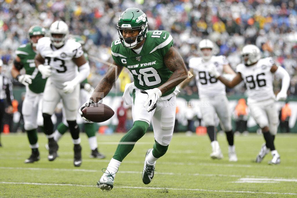 Adam Hunger ADDS THAT THE TOUCHDOWN WAS LATER NULLIFIED BY PENALTY - New York Jets wide receiver Demaryius Thomas (18) runs for a touchdown during the first half of an NFL football game against the Oakland Raiders Sunday, Nov. 24, 2019, in East Rutherford, N.J. The touchdown was later nullified by penalty. (AP Photo/Adam Hunger)