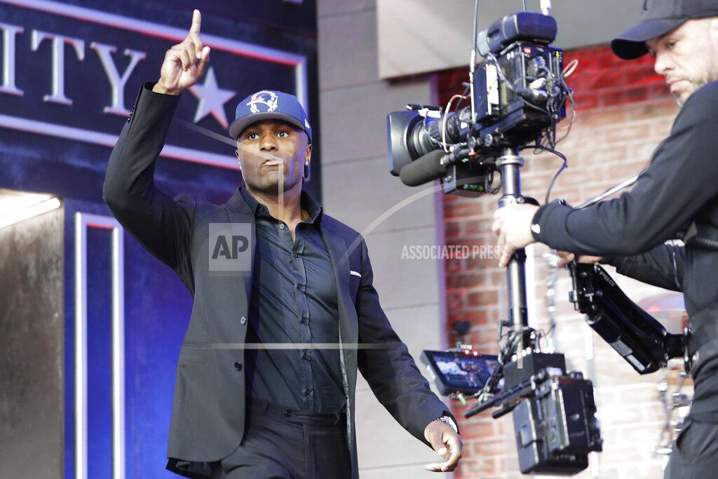 Mark Humphrey Vanderbilt cornerback Joejuan Williams enters the main stage after the New England Patriots selected Williams during the second round of the NFL football draft, Friday, April 26, 2019, in Nashville, Tenn. (AP Photo/Mark Humphrey)