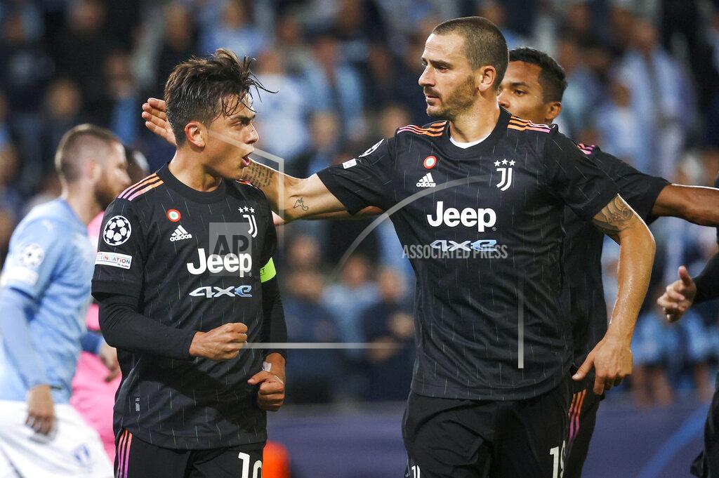 Andreas Hillergren Juventus' Paulo Dybala, left, celebrates scoring a penalty with teammate Leonardo Bonucci during the Champions League group H soccer match between Malmo FF and Juventus FC at Malmo New Stadium in Malmo, Sweden, Tuesday, Sept. 14, 2021. (Andreas Hillergren/TT News Agency via AP)