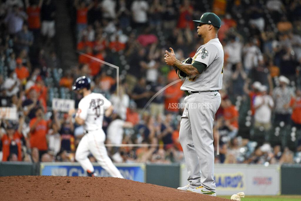 Eric Christian Smith Oakland Athletics starting pitcher Frankie Montas, right, backs off the mound as Houston Astros' Kyle Tucker, back left, rounds the bases after hitting a solo run home run during the seventh inning of a baseball game, Saturday, April 10, 2021, in Houston. (AP Photo/Eric Christian Smith)