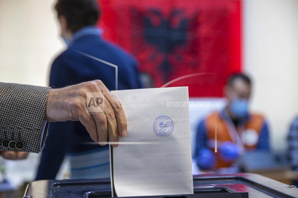 Visar Kryeziu A man casts his ballot during parliamentary elections in capital Tirana, Albania, Sunday, April 25, 2021. Albanians are voting in parliamentary elections amid the virus pandemic and a bitter political rivalry between the two largest political parties. (AP Photo/Visar Kryeziu)