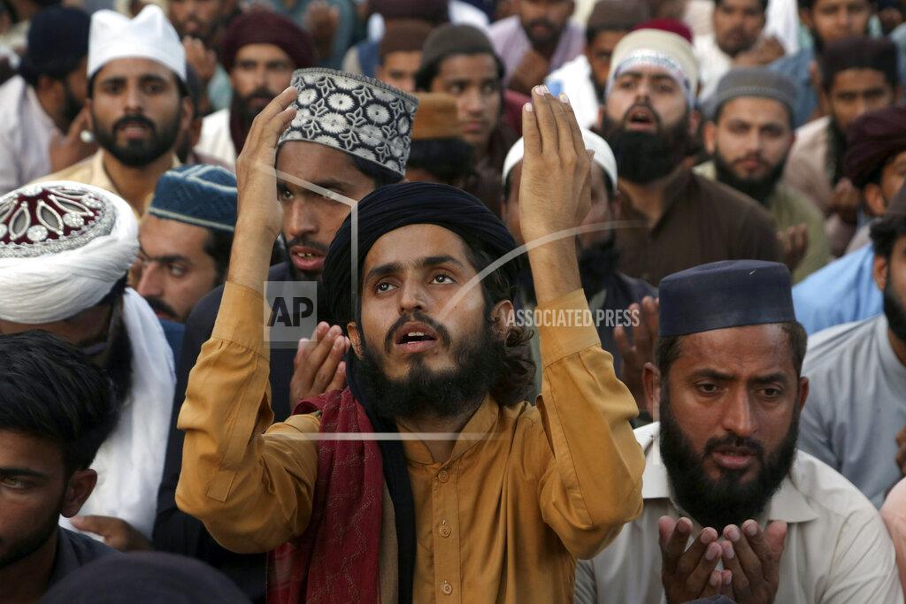 K.M. Chaudary Supporters of Tehreek-e-Labaik Pakistan, a radical Islamist political party, take part in a sit-in protest demanding release of their leader, in Lahore, Pakistan, Thursday, Oct. 21, 2021. Thousands of Islamists are demanding the release of Saad Rizvi, who was arrested in April amid protest against France over depictions of Islam's Prophet Muhammad. (AP Photo/K.M. Chaudary)