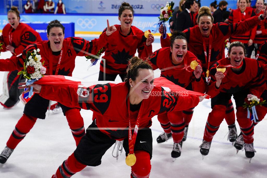 Matt Slocum Canada's Marie-Philip Poulin (29) celebrates with her gold medal after the women's gold medal hockey game at the 2022 Winter Olympics, Thursday, Feb. 17, 2022, in Beijing. (AP Photo/Matt Slocum)