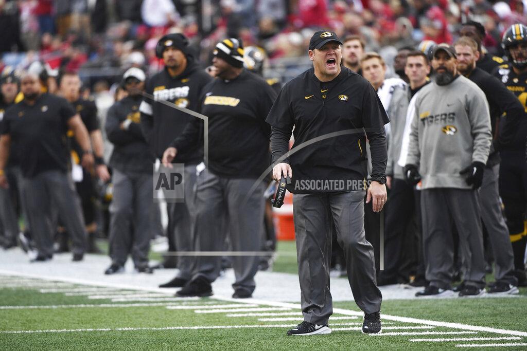 Michael Woods In this Friday, Nov. 29, 2019 photo Missouri coach Barry Odom watches his team during an NCAA college football game against Arkansas in Little Rock, Ark. Missouri fired Odom on Saturday, Nov. 30, 2019, ending the four-year stay of a respected former player who took over a program in disarray but could never get the Tigers over the hump in the brutal SEC. (AP Photo/Michael Woods)