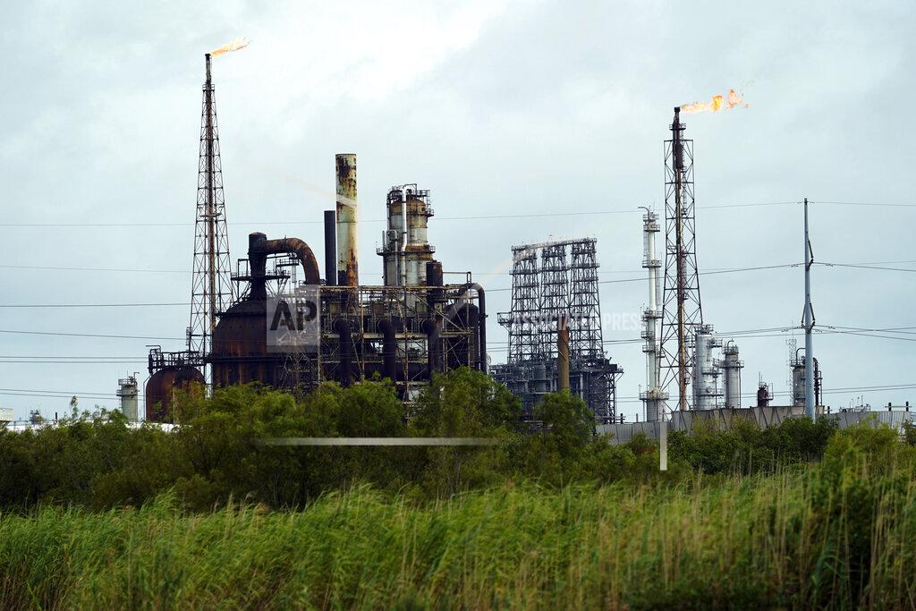 Eric Gay Winds blow the flames at refinery, Wednesday, Aug. 26, 2020, in Port Arthur, Texas. The energy industry is bracing for catastrophic storm surges and winds as Hurricane Laura cuts a dangerous path toward the coastlines of Texas and Louisiana.(AP Photo/Eric Gay)