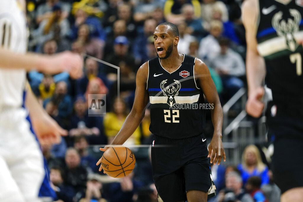 Aj Mast FILE - In this Feb. 12, 2020, file photo, Milwaukee Bucks forward Khris Middleton (22) is shown in action during an NBA basketball game against the Indiana Pacers in Indianapolis. The Milwaukee Bucks have established an emergency relief fund for part-time employees of FiServ Forum, the team’s home arena. The Bucks Emergency Relief Fund will provide financial relief for part-time employees of the arena’s food and beverage provider, housekeeping employer and parking partners. NBA MVP Giannis Antetokounmpo and All-Star forward Khris Middleton have contributed $100,000 each. (AP Photo/AJ Mast, File)