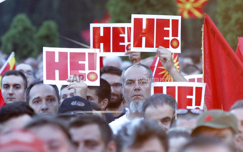 Boris Grdanoski People hold banners reading "No" in Macedonian, during a protest in front of the government building in Skopje, North Macedonia, on Saturday, July 2, 2022. Tens of thousands of people have gathered late on Saturday in North Macedonia's capital Skopje to protest the latest French presidency proposal on solving bilateral disputes with Bulgaria that gave directions for small Balkan country to open membership talks with the European Union. (AP Photo/Boris Grdanoski)