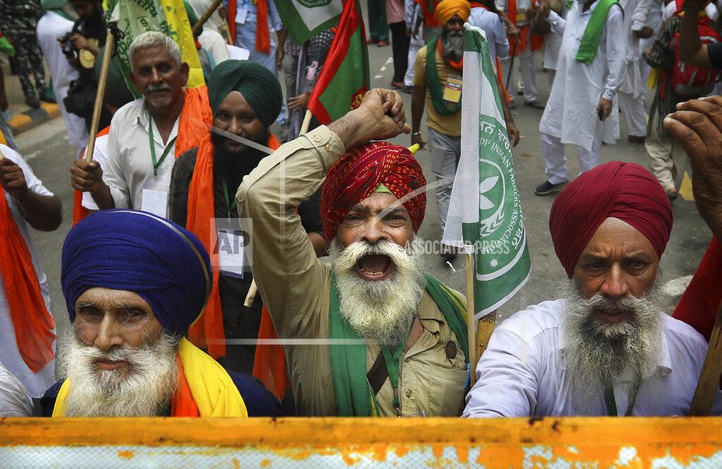 Manish Swarup Farmers shout anti government slogans during a protest in New Delhi, India, Thursday, July 22, 2021. More than 200 farmers on Thursday began a protest near India's Parliament to mark eight months of their agitation against new agricultural laws that they say will devastate their income. (AP Photo/Manish Swarup)
