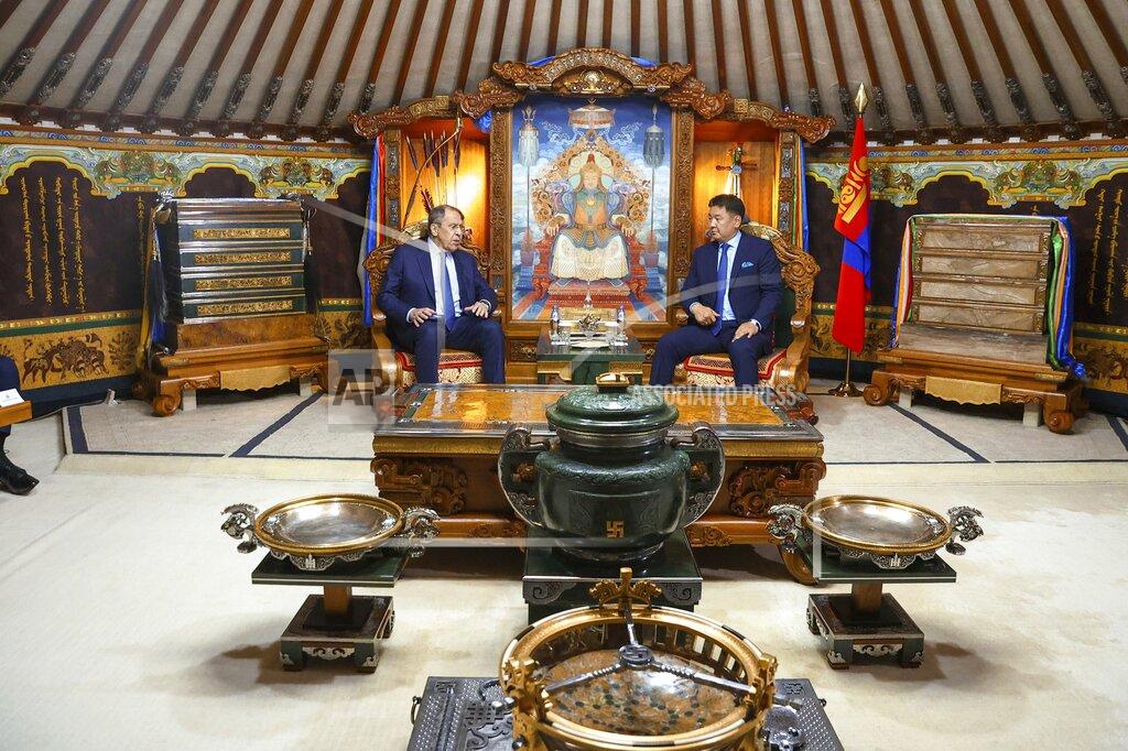 Uncredited In this photo released by Russian Foreign Ministry Press Service, Mongolian President Ukhnaagiin Khurelsukh, right, and Russian Foreign Minister Sergey Lavrov talk during their meeting in Ulaanbaatar, Mongolia, Tuesday, July 5, 2022. (Russian Foreign Ministry Press Service via AP)