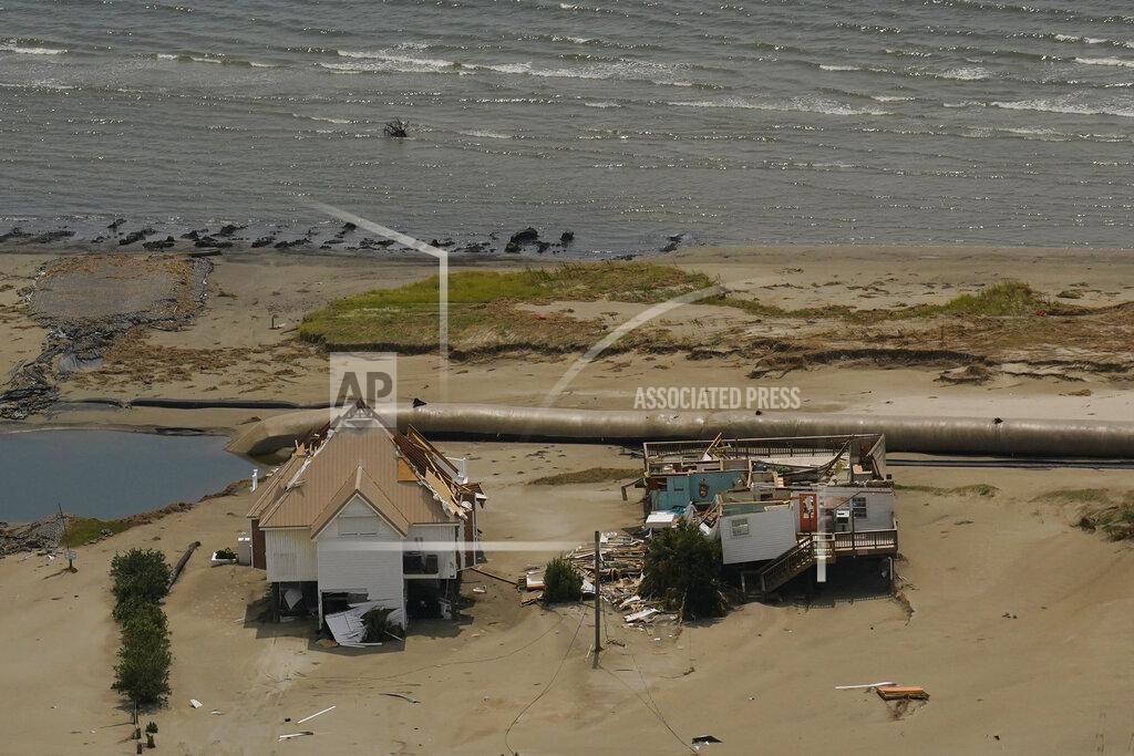 Matt Slocum In this aerial photo, the remains of damaged homes are seen in the aftermath of Hurricane Ida, Monday, Sept. 6, 2021, in Grand Isle, La. (AP Photo/Matt Slocum)