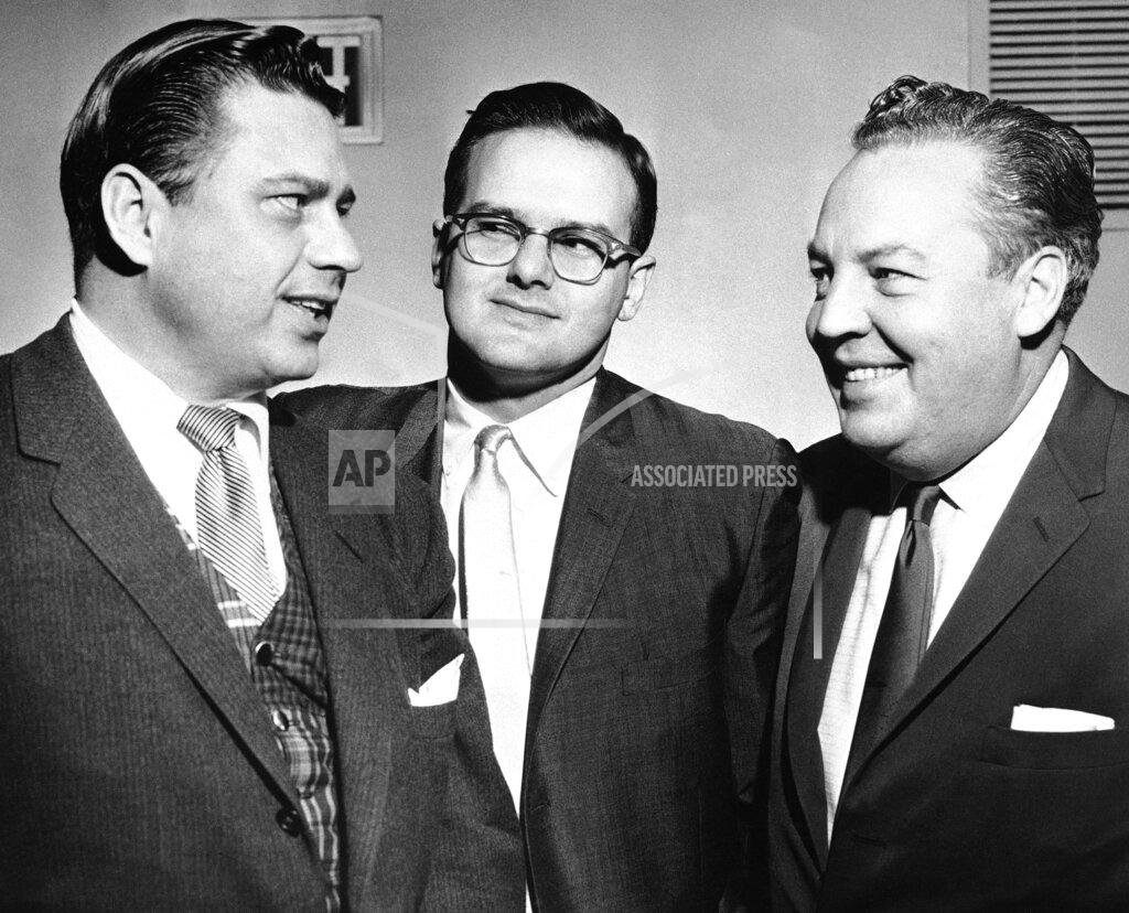 Anonymous FILE -- This Jan. 26, 1960, file photo shows American Football League president Lamar Hunt, center, flanked by Bud Adams, left, owner of the Houston AFL team, and Harry Wismer, owner of the New York AFL team, in Dallas. Lamar Hunt was a champion of Black rights during the Civil Rights era of the 1960s. He grew up in conservative circles yet formed his own opinions of right and wrong. (AP Photo/File)