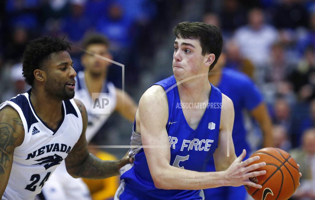 David Zalubowski Air Force guard Chris Joyce, right, looks to pass the ball as Nevada forward Jordan Caroline defends during the second half of an NCAA college basketball game Tuesday, March 5, 2019, at Air Force Academy, Colo. Nevada won 90-79. (AP Photo/David Zalubowski)