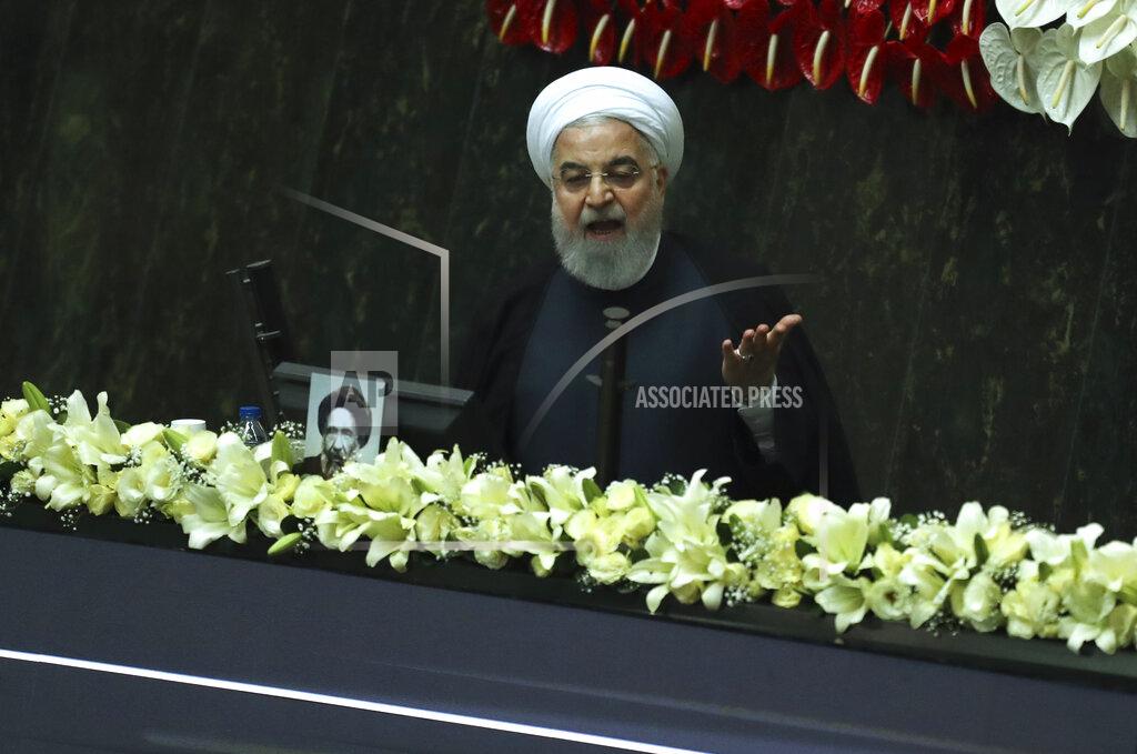 Vahid Salemi Iranian President Hassan Rouhani speaks during the inauguration of the new parliament in Tehran, Iran, Wednesday, May, 27, 2020. Iran convened its newly elected parliament, dominated by conservative lawmakers and under strict social distancing regulations, as the country struggles to curb the spread of coronavirus that has hit the nation hard. Iran is grappling with one of the deadliest outbreaks in the Middle East. (AP Photo/Vahid Salemi)