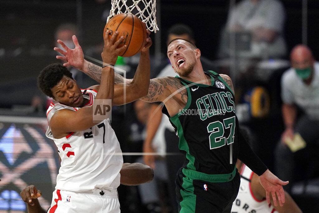 Toronto Raptors' Kyle Lowry (7) grabs a rebound in front of Boston Celtics' Daniel Theis (27) in the second half of an NBA conference semifinal playoff basketball game, Tuesday, Sept. 1, 2020, in Lake Buena Vista, Fla. (AP Photo/Mark J. Terrill)
