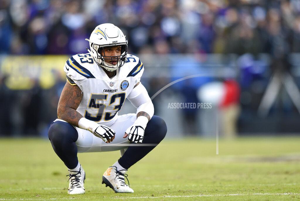 Gail Burton FILE - In this Jan. 6, 2019, file photo, Los Angeles Chargers center Mike Pouncey kneels on the field in the second half of an NFL wild card playoff football game against the Baltimore Ravens in Baltimore. Pouncey says he is ready to go whenever NFL teams are allowed to return to their facilities and hold workouts or training camp. Where Pouncey and his Los Angeles Chargers teammates might be playing though is becoming a bigger question. (AP Photo/Gail Burton, File)