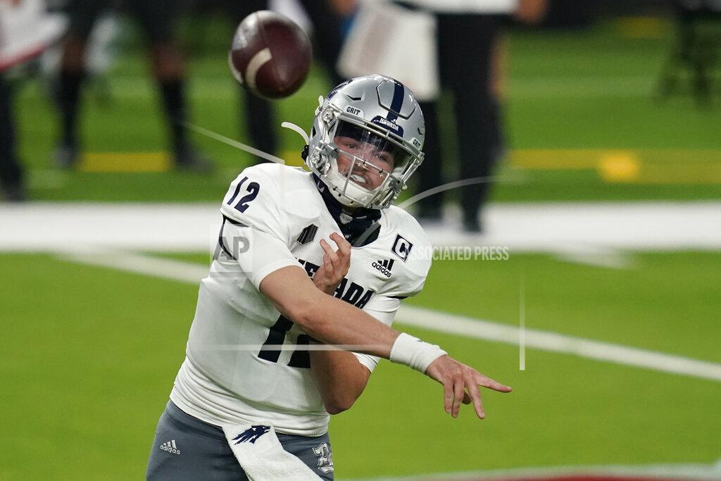 John Locher Nevada quarterback Carson Strong (12) throws against UNLV during the second half of an NCAA college football game Saturday, Oct. 31, 2020, in Las Vegas. (AP Photo/John Locher)